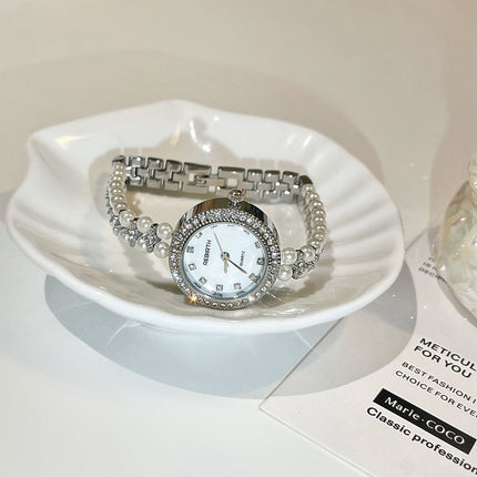 Damesarmband oesjaar varswater pêrelhorlosie