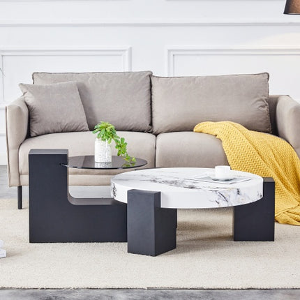 Moderne Eenvoudige Dubbellaag Ronde Koffietafel – Deursigtige Grys Glasblad Met Swart MDF L-vormige Pote. Die Afneembare Ontwerp Kan Die Gebruik Van Ruimte Buigsamer Maak