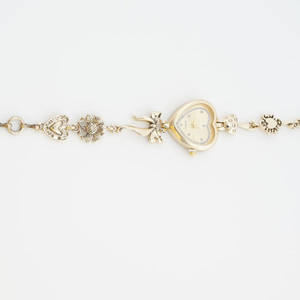 Retro Heart-shaped Bracelet Watch With A Golden Bow And Flower Design A Stylish Womens Timepiece