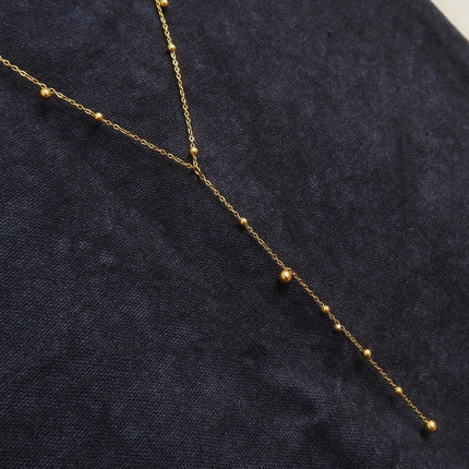Y-shaped Necklace With A Tassel Pendant And Round Beads