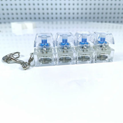 4 Sleutels Meganiese Sleutelbord Elektroniese Liggende Deursigtige Kristal Hoogte Drukvermindering Vingerknoppie Anti-Stres Sleutelknop Speelding Skooltassleutelhanger Dekompressie Klikker Gadget Geskenk