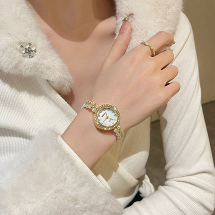 Damesarmband oesjaar varswater pêrelhorlosie
