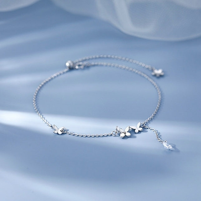 Skoenlapper-enkelband, met 'n uitsoek-skoenlapperontwerp wat rats en elegant is. Die dun ketting pas die enkel knus en gloei met 'n effense glinstering, wat romantiese vindingrykheid by someruitrustings voeg.
