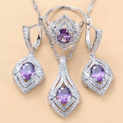 Oorringe met juweelinlegsel, hangertjie, halssnoer, ring Drie-stuk stel vir dames
