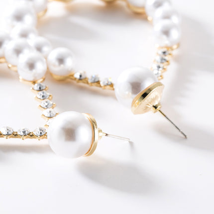 Diamond imitation pearl earrings