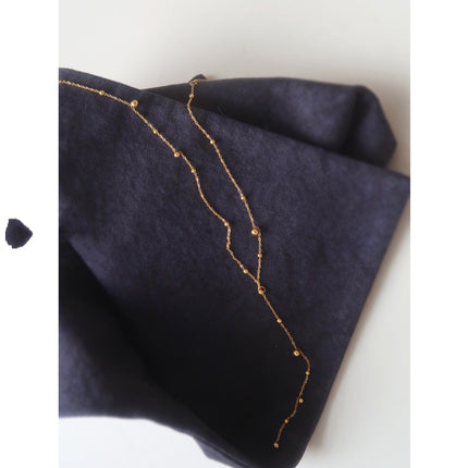 Y-shaped Necklace With A Tassel Pendant And Round Beads