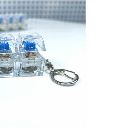 4 Sleutels Meganiese Sleutelbord Elektroniese Liggende Deursigtige Kristal Hoogte Drukvermindering Vingerknoppie Anti-Stres Sleutelknop Speelding Skooltassleutelhanger Dekompressie Klikker Gadget Geskenk