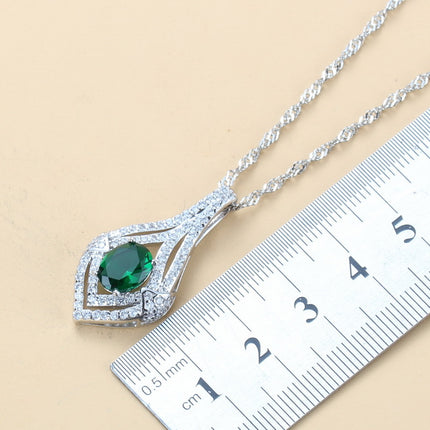 Oorringe met juweelinlegsel, hangertjie, halssnoer, ring Drie-stuk stel vir dames