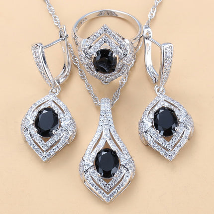 Oorringe met juweelinlegsel, hangertjie, halssnoer, ring Drie-stuk stel vir dames