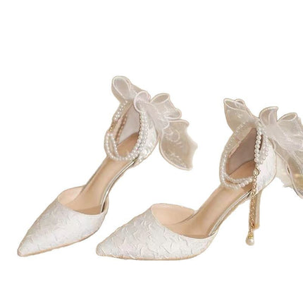 Platformstiletto’s met strik agter en spits toon